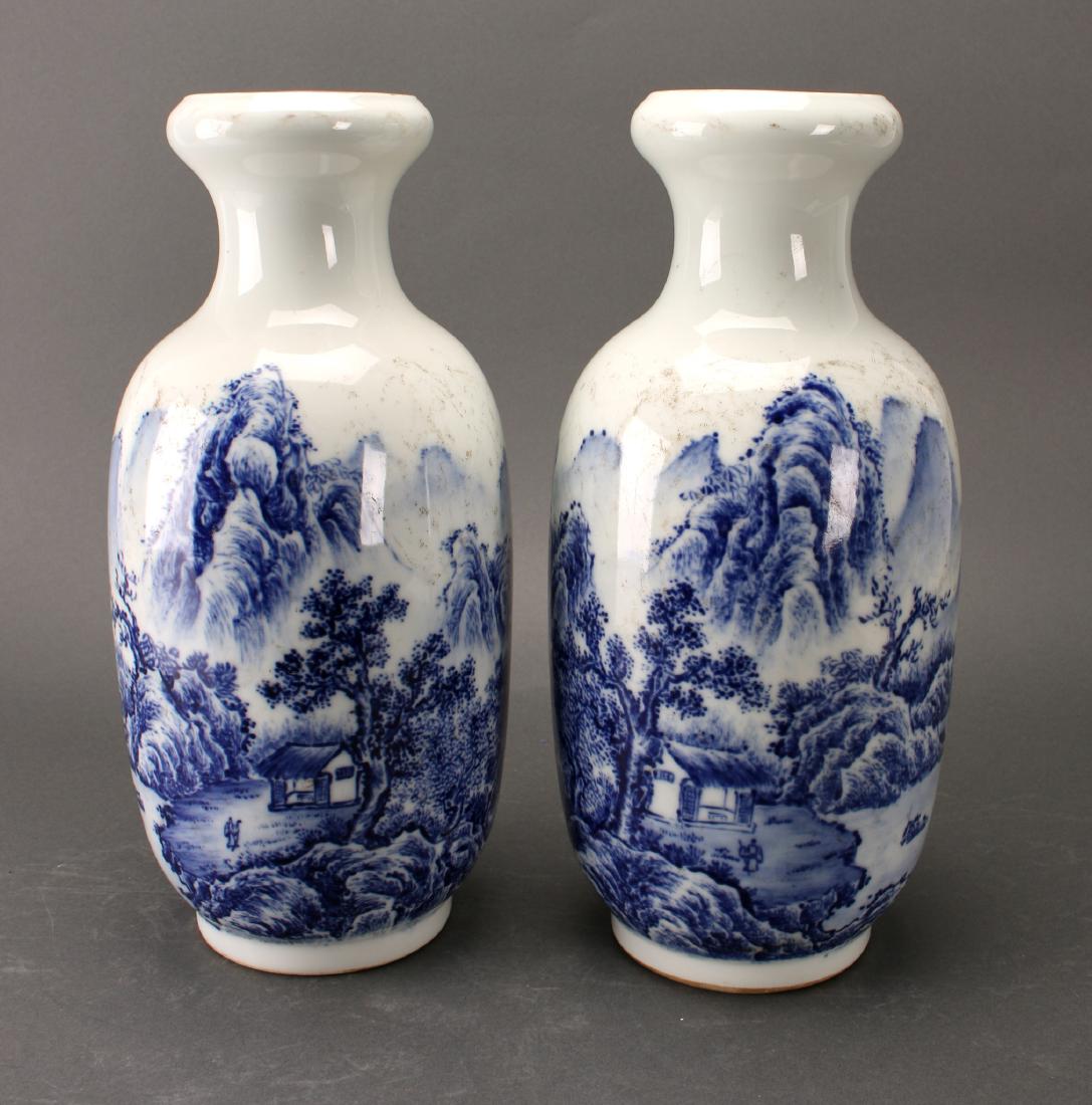 PAIR OF BLUE AND WHITE ROULEAU VASES (1 of 9)