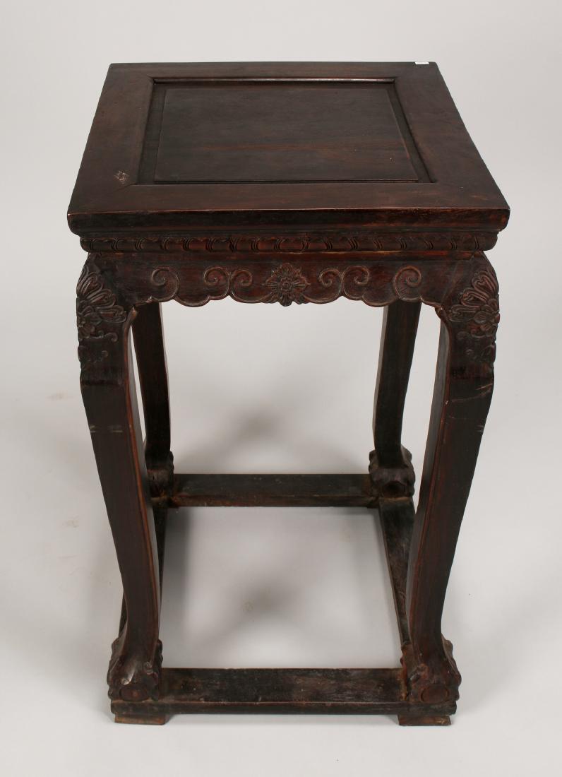 ZITAN END TABLE: Zitan End Table: A Zitan end table carved with lotus flowers. It has a raised panel, inset top, ball and claw foot, and a beaded scalloped edge. 28" X 16 3/4" X 1