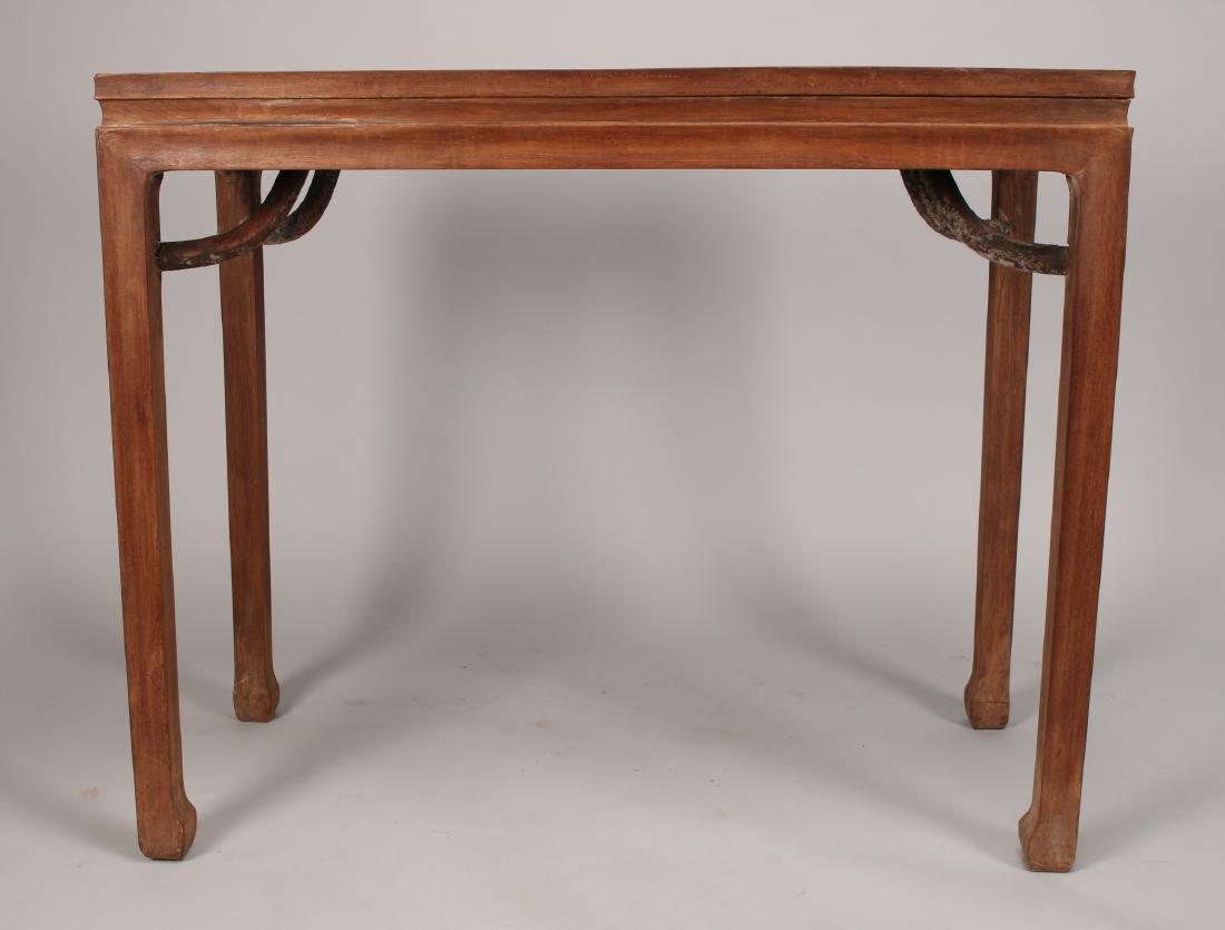 HUANG HUA LI PAINTING TABLE: Huang Hua Li Painting Table: A Huanghuali painting table with giant's arms supports, a panel inset top, and tri-miter construction. 39 1/4" X 18" X 32 1/2"</