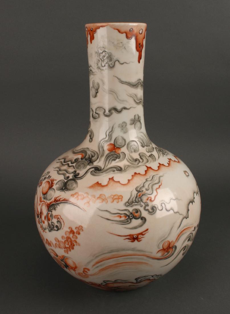 ORANGE AND GRAY GLOBULAR VASE: Orange And Gray Globular Vase: A flaming pearl and clouds are buffeted by strong winds on this dramatic vase. Orange shapes drip from the rim contrasting from the turquoise glazed interior. Marked on