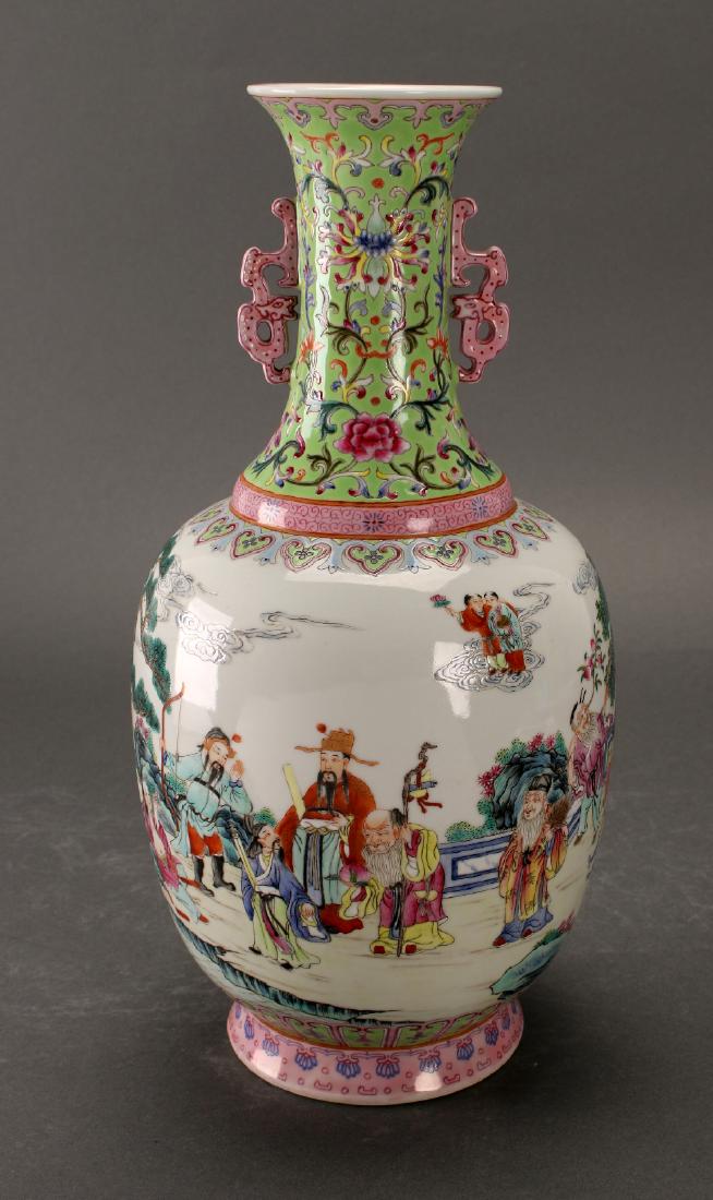 VASE WITH IMMORTALS: Vase With Immortals: Immortals have their associated objects in a scene around the body of the vase. They are walking with staffs, playing instruments, and holding the gourd that emits a cloud transfo