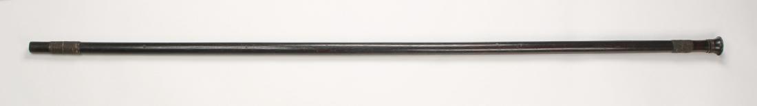 AFRICAN WOODEN BLOWGUN: African Wooden Blowgun: This hard wood blowgun is wrapped in cord on both ends. It has a trumpeted mouth with three raised rings directly below the opening. 59"