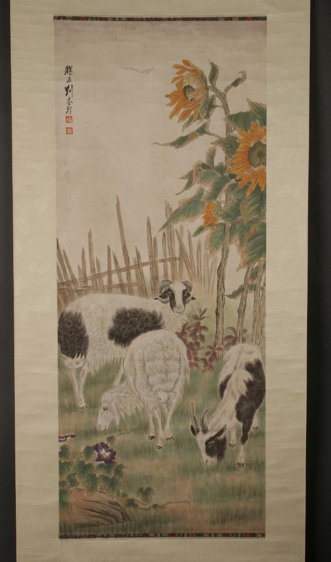 SCROLL OF GOATS AND SUNFLOWERS: Scroll Of Goats And Sunflowers: Three goats graze on grass in a field near tall sunflowers, a bamboo fence is behind them. Calligraphy and artist mark on upper left. 83"