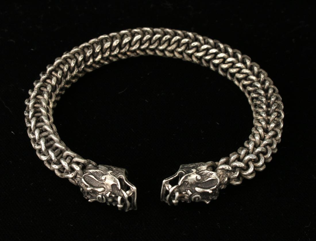 TIBETAN BANGLE BRACELET: Tibetan Bangle Bracelet: Chain bangle bracelet with dragon-head ends 2 1/2" diameter $100 - $200 Shipping: We are able to pack