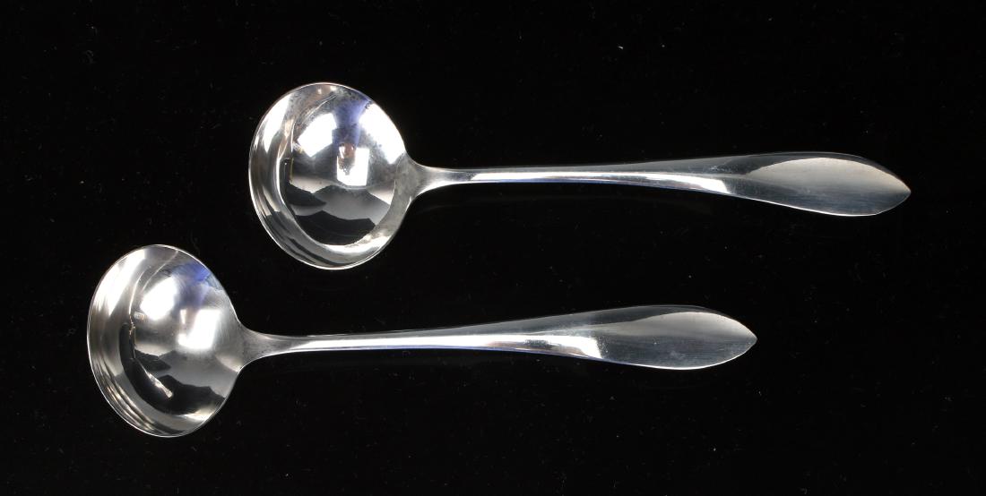 TWO SMALL STERLING SAUCE LADLES. (1 of 4)