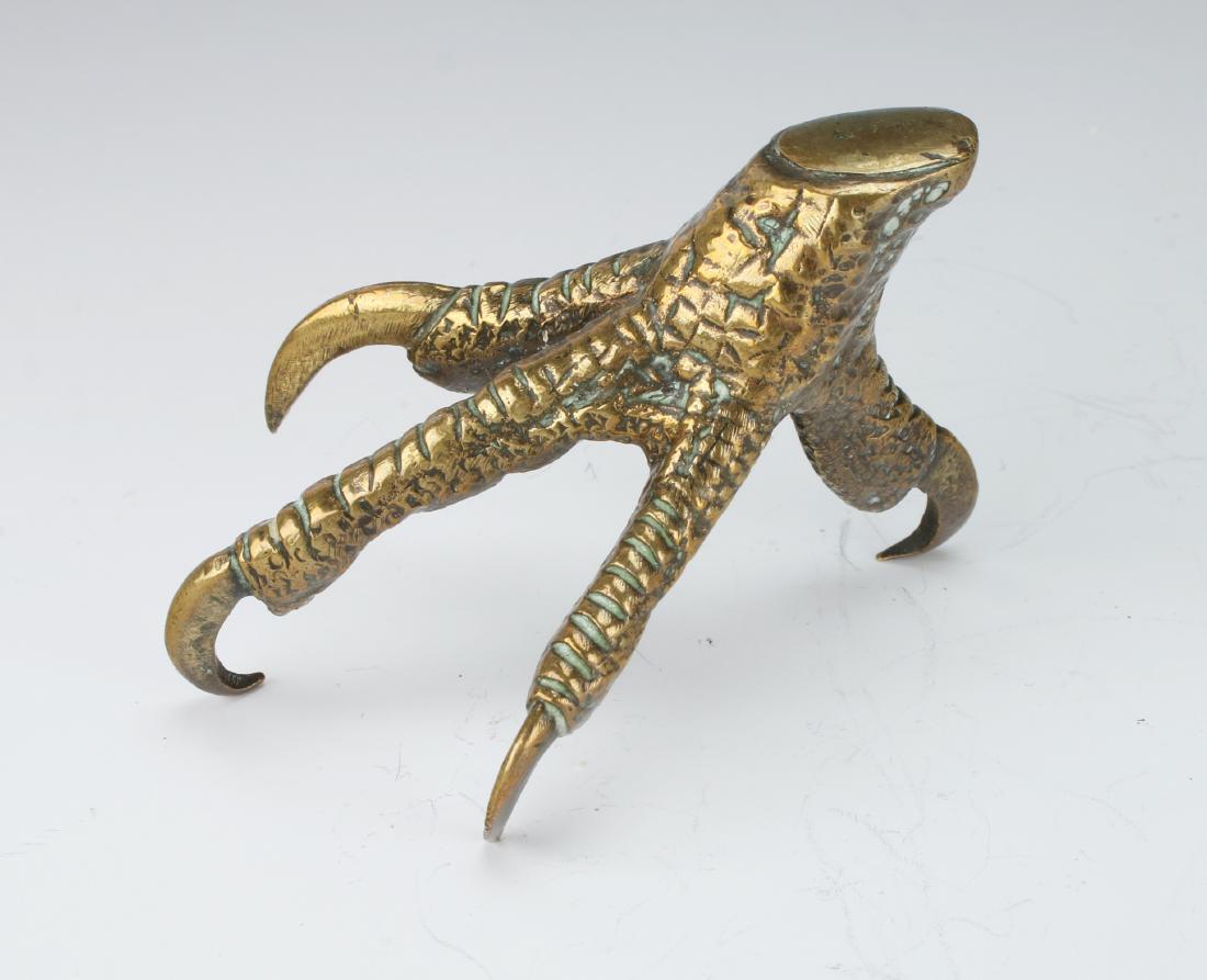 EAGLE TALON PAPERWEIGHT: Eagle Talon Paperweight: Naturalistically textured with sharp claws. 3" X 2" $100 - $200 Shipping: We are able to pack and