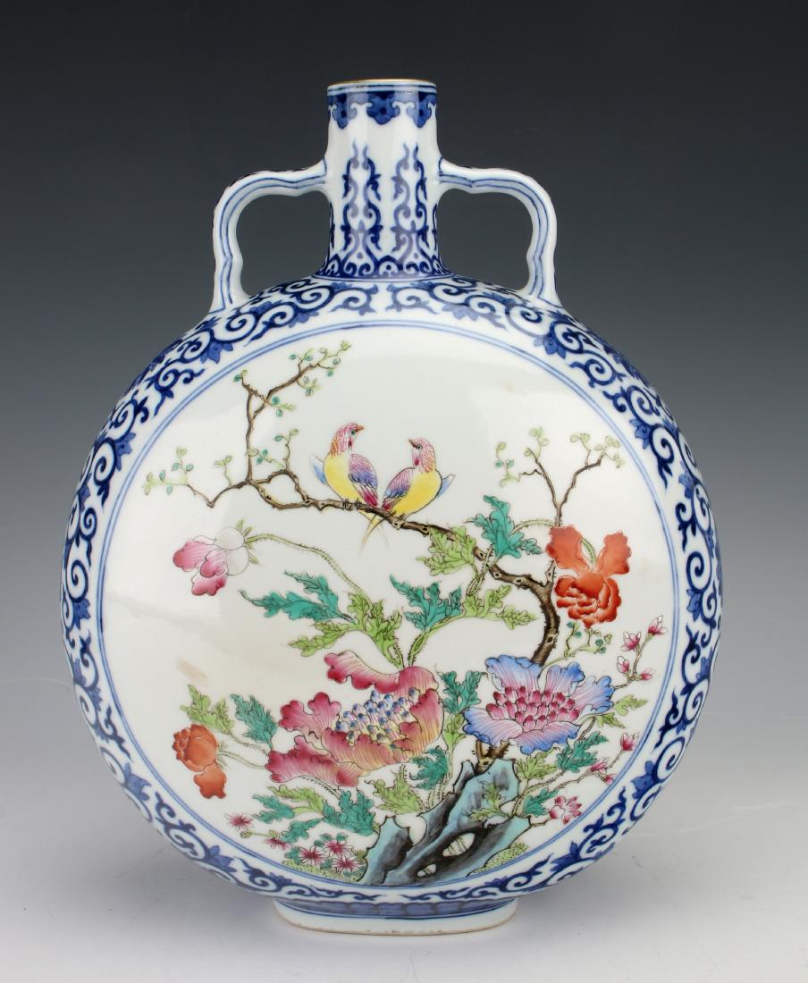 QIANLONG FAMILLE ROSE BIRD MOON FLASK: QIANLONG FAMILLE ROSE BIRD MOON FLASK: One side has a reserve of a pair of song birds perched on a branch in the garden, colorful flowers bloom nearby. The other side has the same scene with different