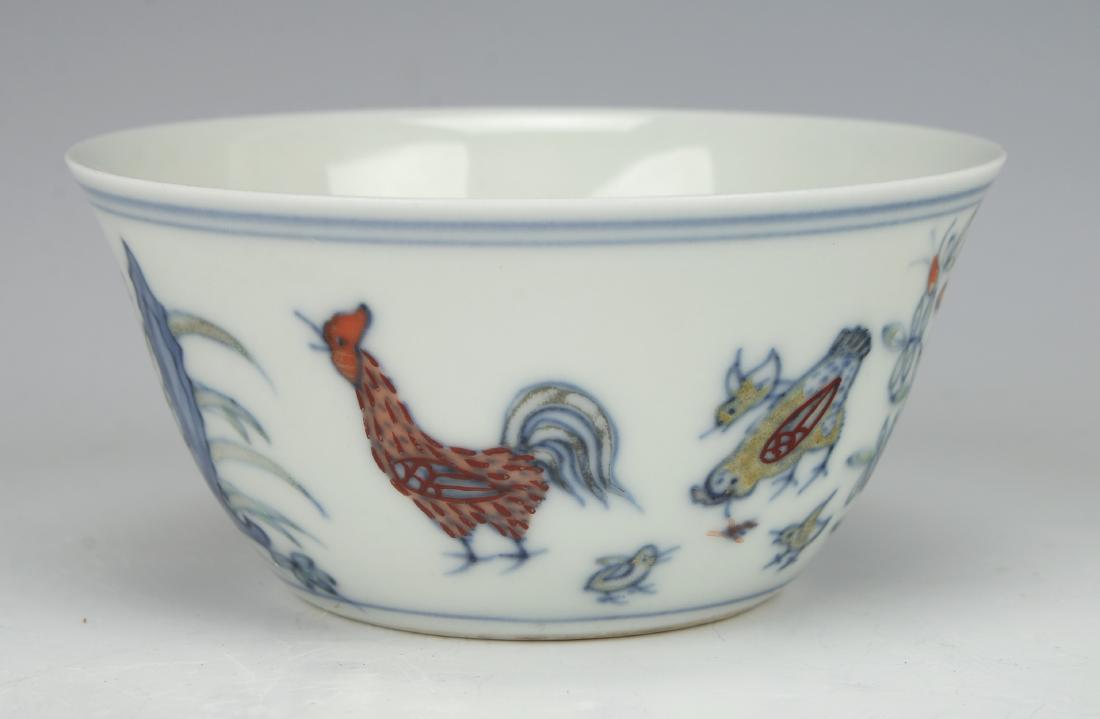 ANTIQUE CHINESE PORCELAIN ROOSTER CUP: ANTIQUE CHINESE PORCELAIN ROOSTER CUP: Rooster cup with a Chenghua mark on the bottom. There is a rooster, hen, chicks, and a boulder. 3 1/2" X 1 3/4" $80