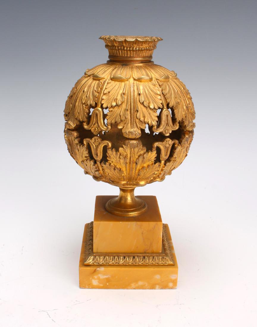 FRENCH ORMOLU CENSER CASSOLETTE: FRENCH ORMOLU CENSER CASSOLETTE: In a pierced orb form on a two tiered marble base in flower and leaf patterns. 8" $800 - $1200 Shipping: