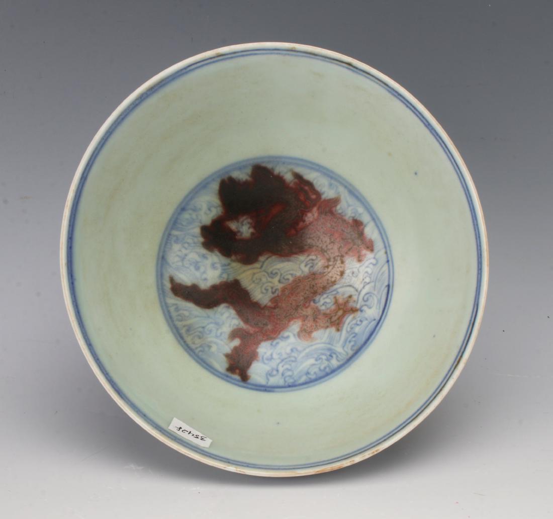 MING DYNASTY RED & BLUE DRAGON BOWL: MING DYNASTY RED & BLUE DRAGON BOWL: Red dragons on wave patterns on the outside. The inside has a red dragon on a wave pattern. Marked on the bottom within a rectangle. Xuande six character reign