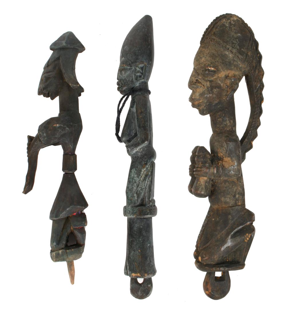 THREE CARVED AFRICAN STATUES (1 of 6)