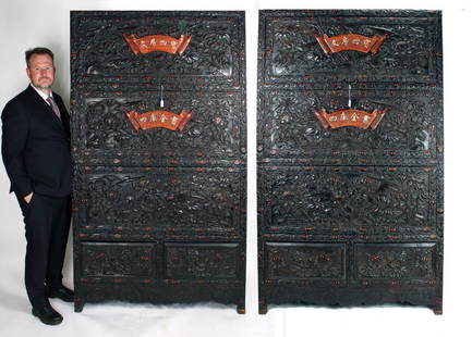 PAIR OF ELABORATELY CARVED ZITAN CABINETS: PAIR OF ELABORATELY CARVED ZITAN CABINETS : The compartments that have top sliding doors and two drawers on the bottom. They are thoroughly carved with lotus blossoms and pods. Each pod has three rota