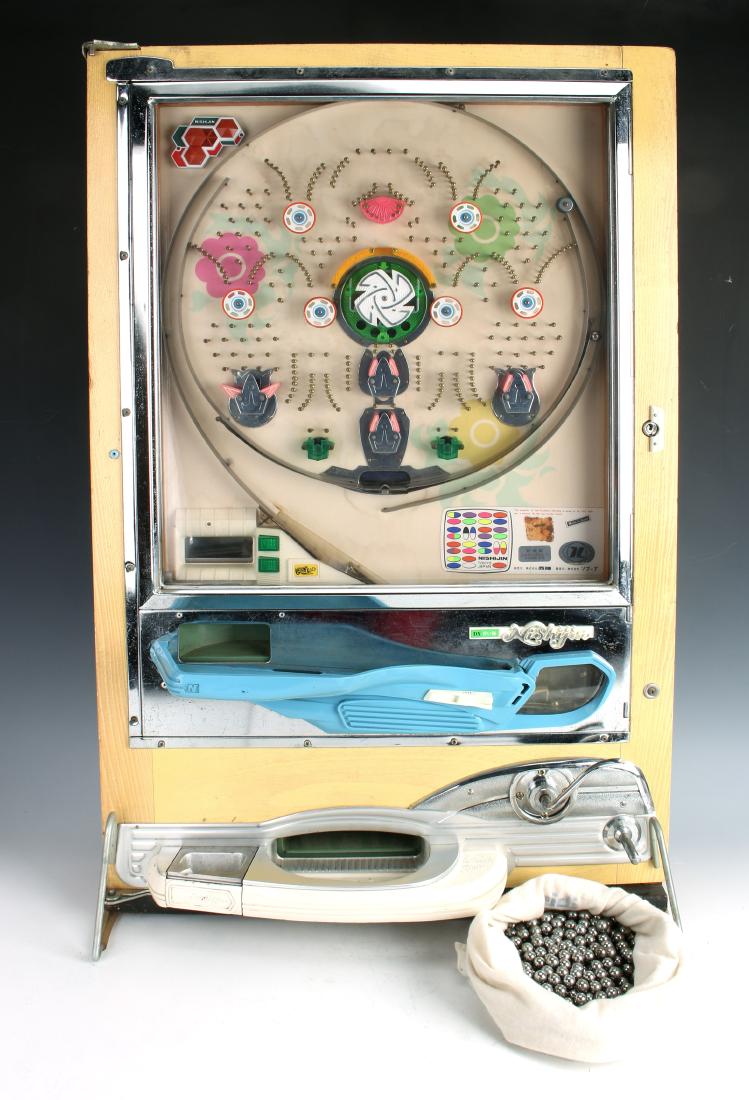 VINTAGE JAPANESE PACHINKO MACHINE NISHJIN: VINTAGE JAPANESE PACHINKO MACHINE NISHJIN: In original shipping box, comes with instructions and metal balls. Labeled DX, made by Nishijin. Model number 239-2, marked Made in Japan.