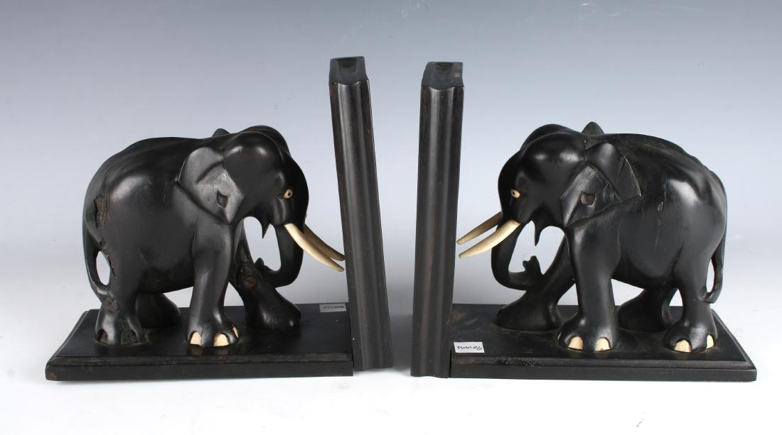 ELEPHANT BOOKENDS: ELEPHANT BOOKENDS: Carved in ebony with bone toenails and tusks. 8" X 7" $100 - $200 Shipping: We are able to pack and sh
