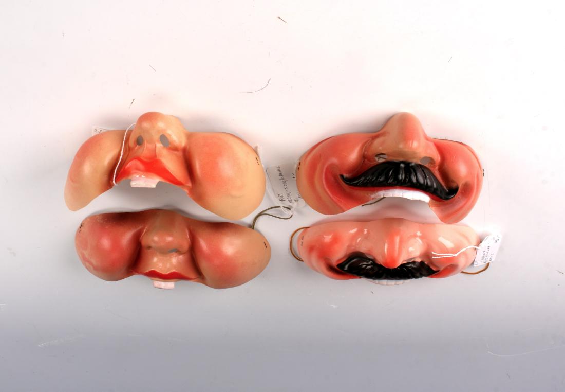 LOT OF FOUR VINTAGE NOSE & CHEEK MASKS: LOT OF FOUR VINTAGE NOSE & CHEEK MASKS: Two are boys, two are girls. One of each of the girls and boys masks is marked Made in France. 6 1/2" $40 - $80