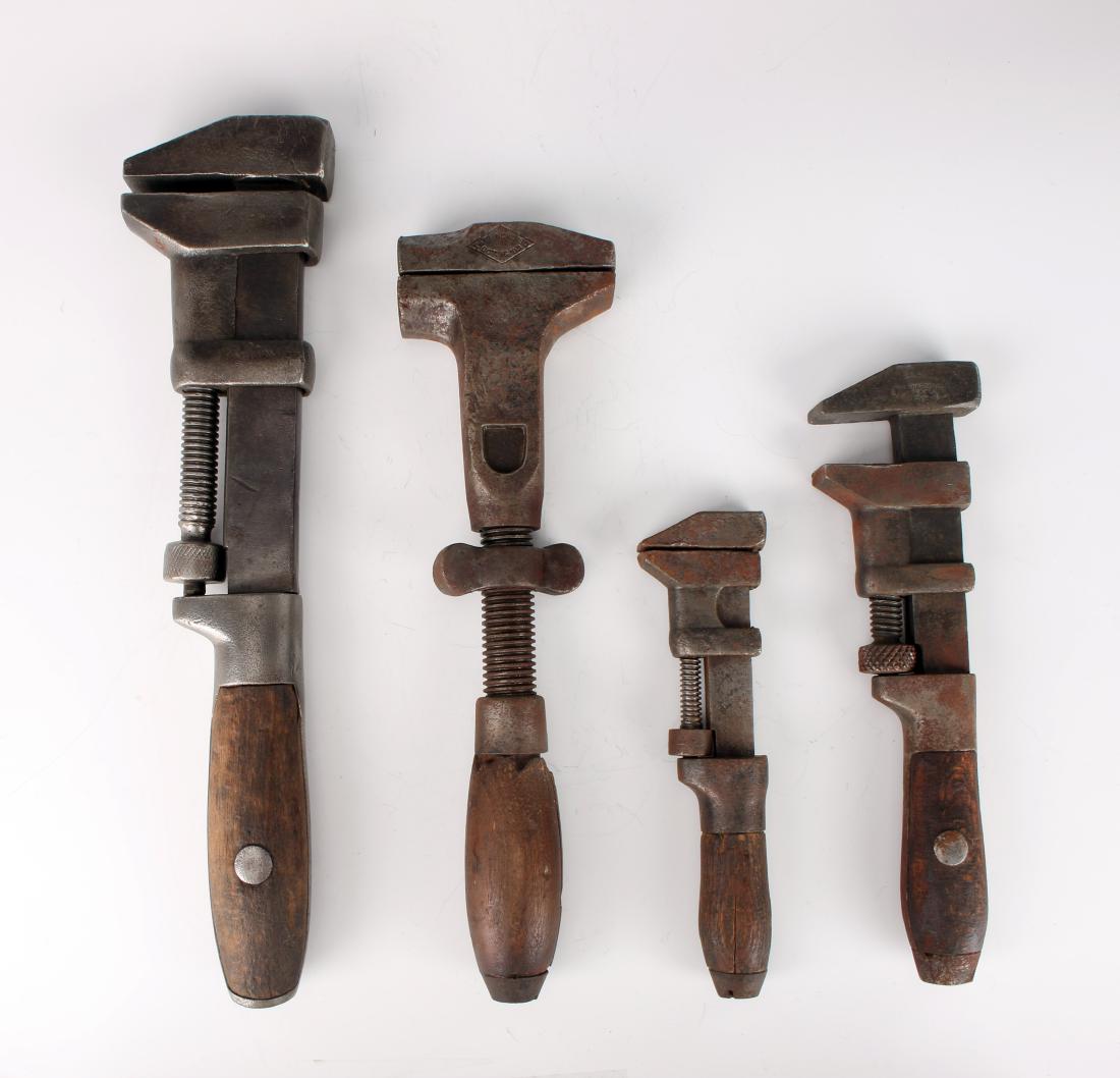 FOUR ANTIQUE ADJUSTABLE WRENCHES