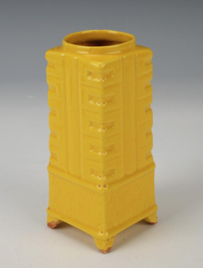 SMALL SQUARE YELLOW CONG STYLE VASE: SMALL SQUARE YELLOW CONG STYLE VASE: Bright yellow glaze all over on four feet. The glaze stops before the very bottom of the unglazed feet. Marked on the bottom. 2 1/4"