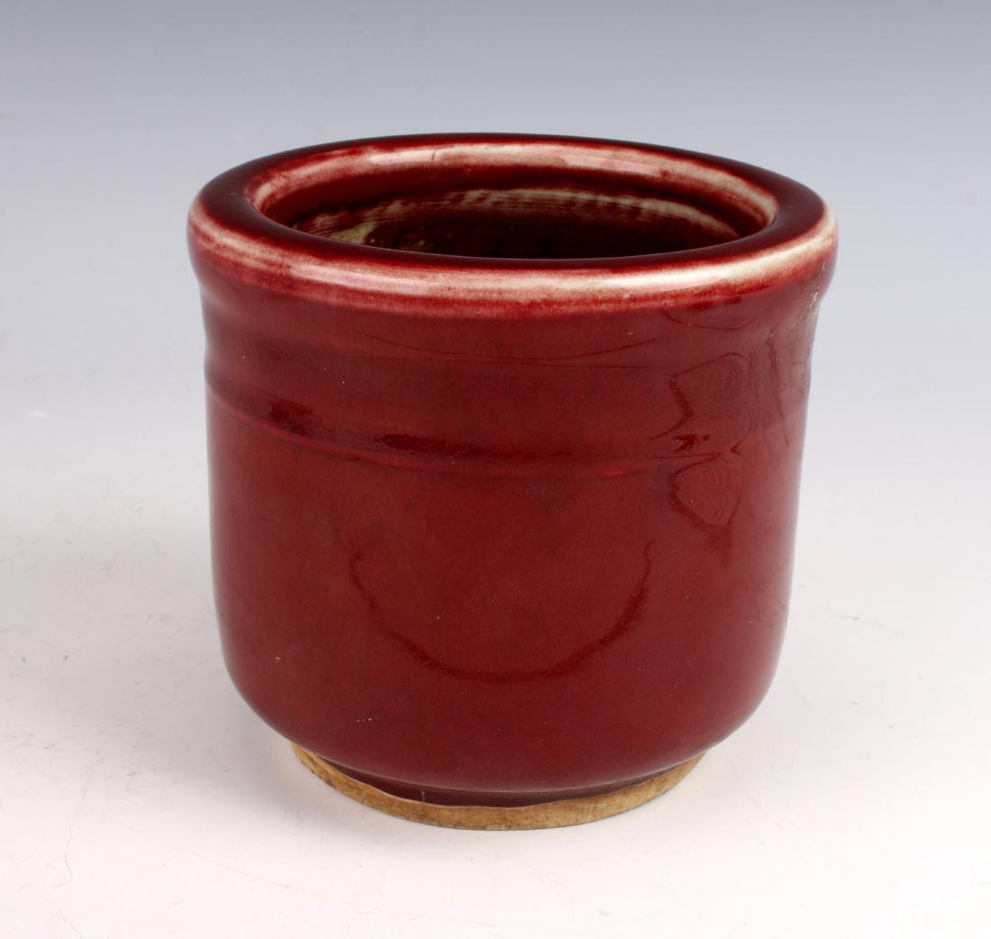 OX BLOOD BRUSH POT: OX BLOOD BRUSH POT: Ridged at the top on a low unglazed foot. 4 1/2" X 4" $40 - $80 Shipping: We are able to pack and shi
