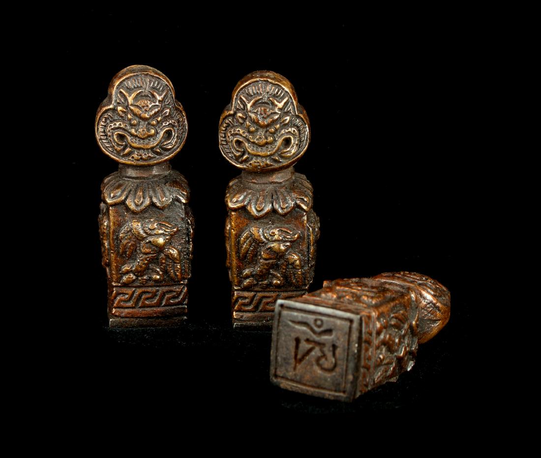 THREE SMALL TIBETAN BRONZE SEALS (1 of 6)