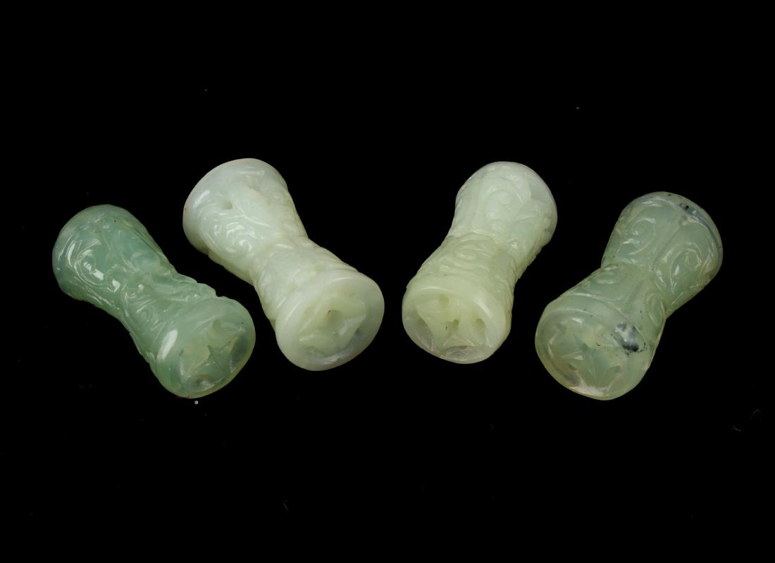 FOUR CARVED & PIERCED JADE BUDDHIST BEADS (1 of 4)