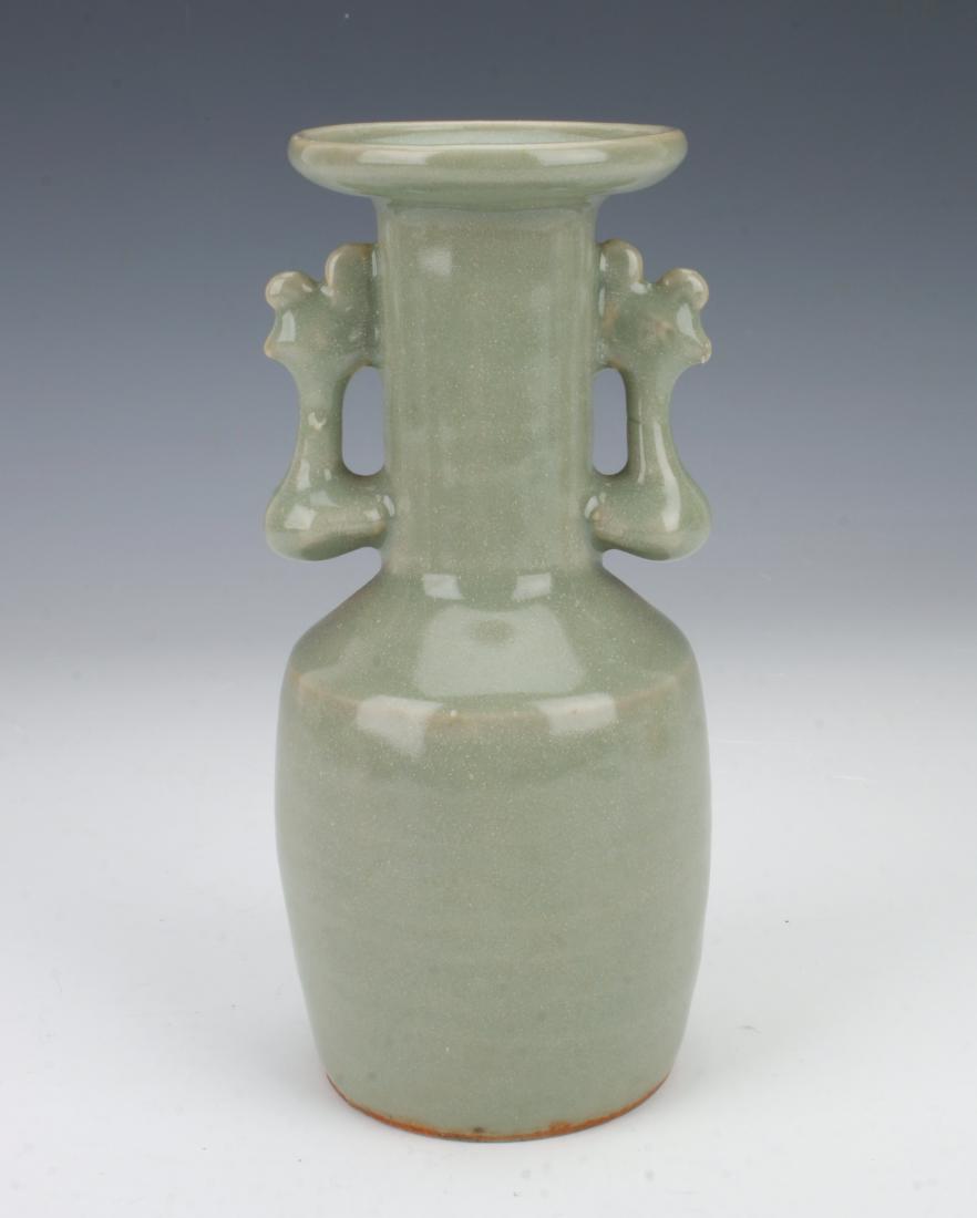 SMALL ANTIQUE CELADON VASE: SMALL ANTIQUE CELADON VASE: Small celadon vase with pierced handles on either side and a wide flanged rim at the top. 2 3/4" X 6" $400 - $600 Sh