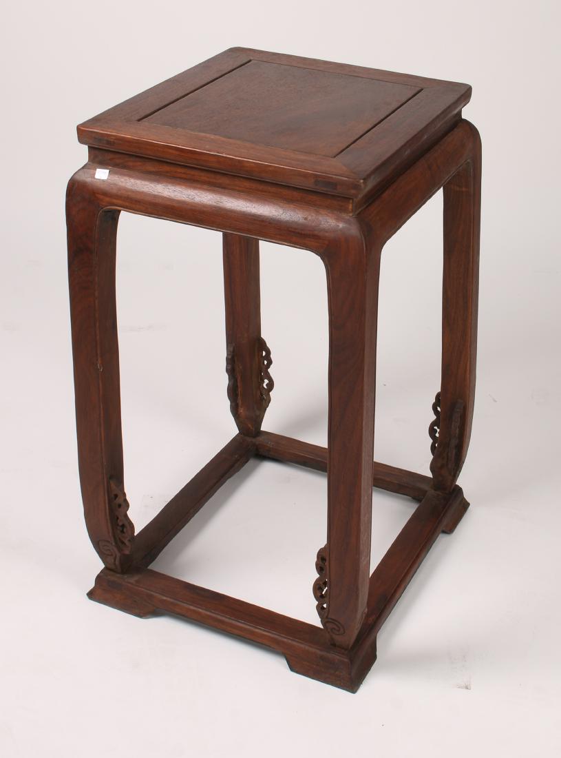 HUANGHUALI SIDE TABLE: HUANGHUALI SIDE TABLE: Floating panel top, pierced decorative flanges on the feet, on a low footed pedestal. 17 3/4" X 15" X 28 1/2" $500 - $800 <