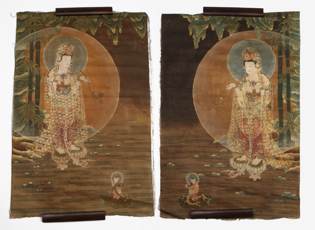 PAIR OF MIRROR THANGKA BUDDHA PAINTINGS: PAIR OF MIRROR THANGKA BUDDHA PAINTINGS: Buddha has a flower in one hand with a haloed supplicant kneeling at his feet. He is standing in a bamboo garden on top of lotus blossoms. The painting is acce