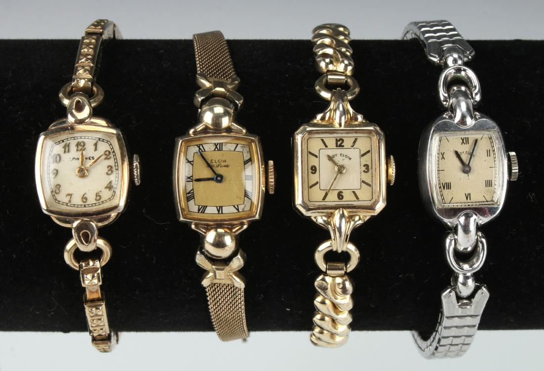 FOUR VINTAGE LADIES WRIST WATCHES: FOUR VINTAGE LADIES WRIST WATCHES: Three Elgin wrist watches and one Longines watch. Three are yellow gold filled, one silver colored one. All are gold filled. 7"<