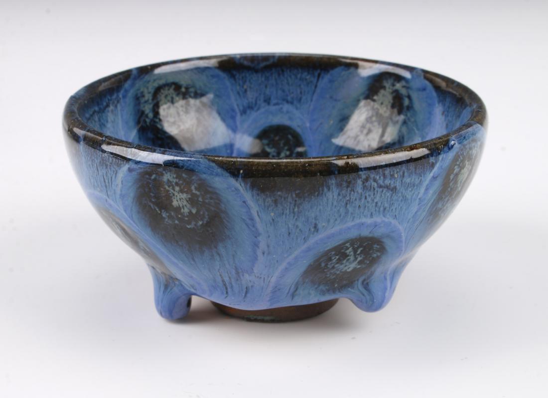 SMALL ANTIQUE CHINESE PEACOCK GLAZED BOWL: SMALL ANTIQUE CHINESE PEACOCK GLAZED BOWL: Small peacock glazed bowl with a thick drip glaze that stops at the unglazed bottom and foot. 3 1/2" X 1 3/4" $