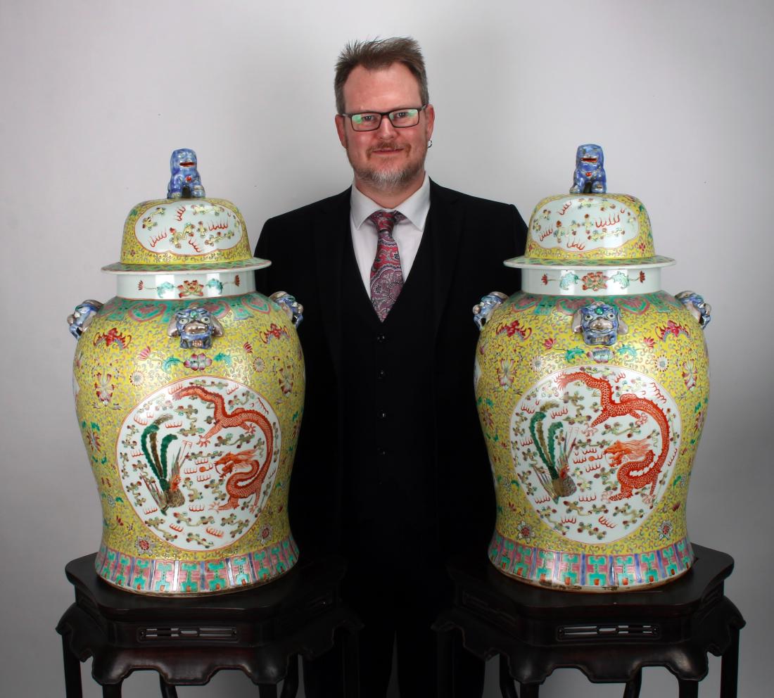 PAIR OF LARGE DRAGON & PHOENIX GINGER JARS: PAIR OF LARGE DRAGON & PHOENIX GINGER JARS: Very large famille jaune ginger jars with foo dog finials on the lid. The background is bright yellow with blue and pink tendrils. There are reserves of