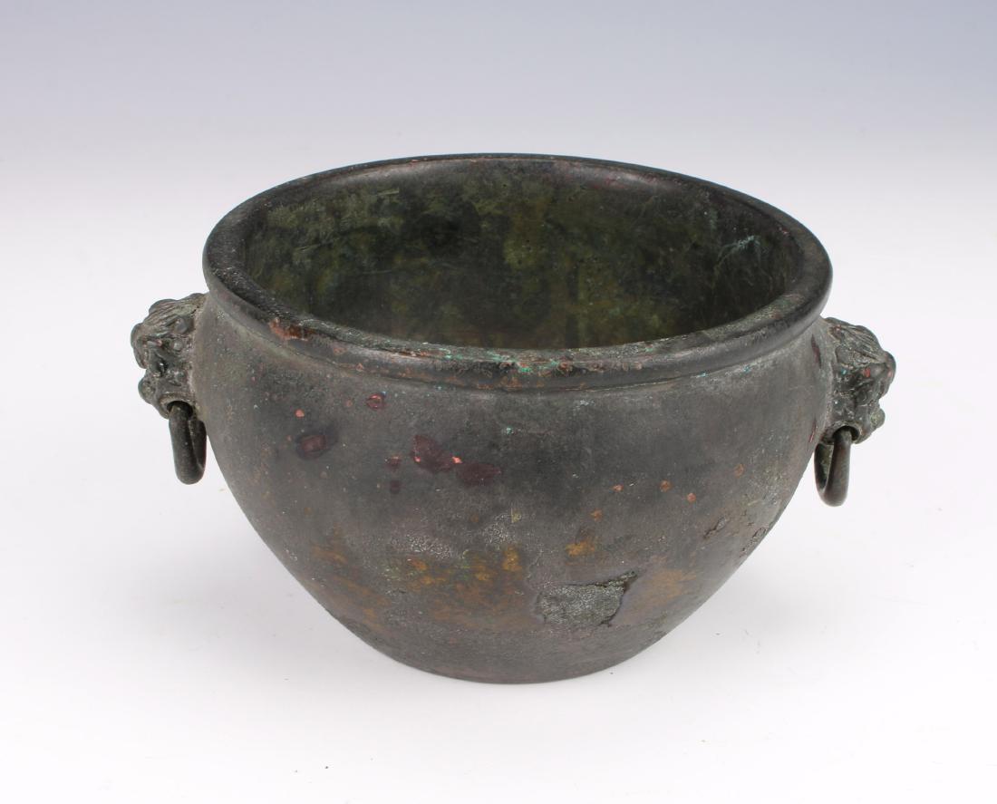 ANTIQUE ROUND BRONZE CENSER: ANTIQUE ROUND BRONZE CENSER: A round bronze censer with lion handles with loose rings. Marked on the bottom. 5" X 2 1/2" $500 - $800 Shipping:</