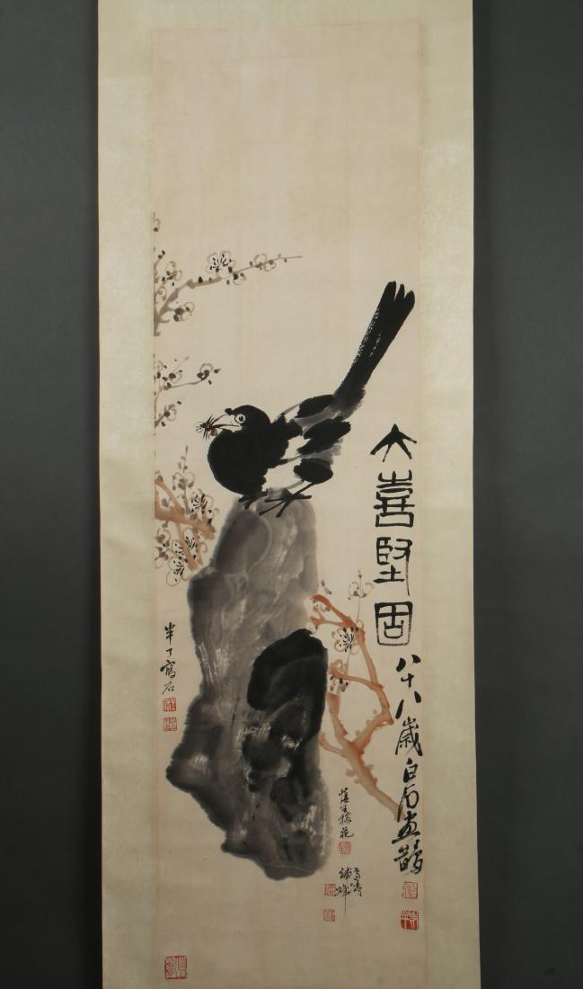 SCROLL OF CROW EATING BEE: SCROLL OF CROW EATING BEE: A crow sits atop a boulder munching a bee surrounded by cherry blossoms. Calligraphy and artist marks all over. 81" X 23" $400