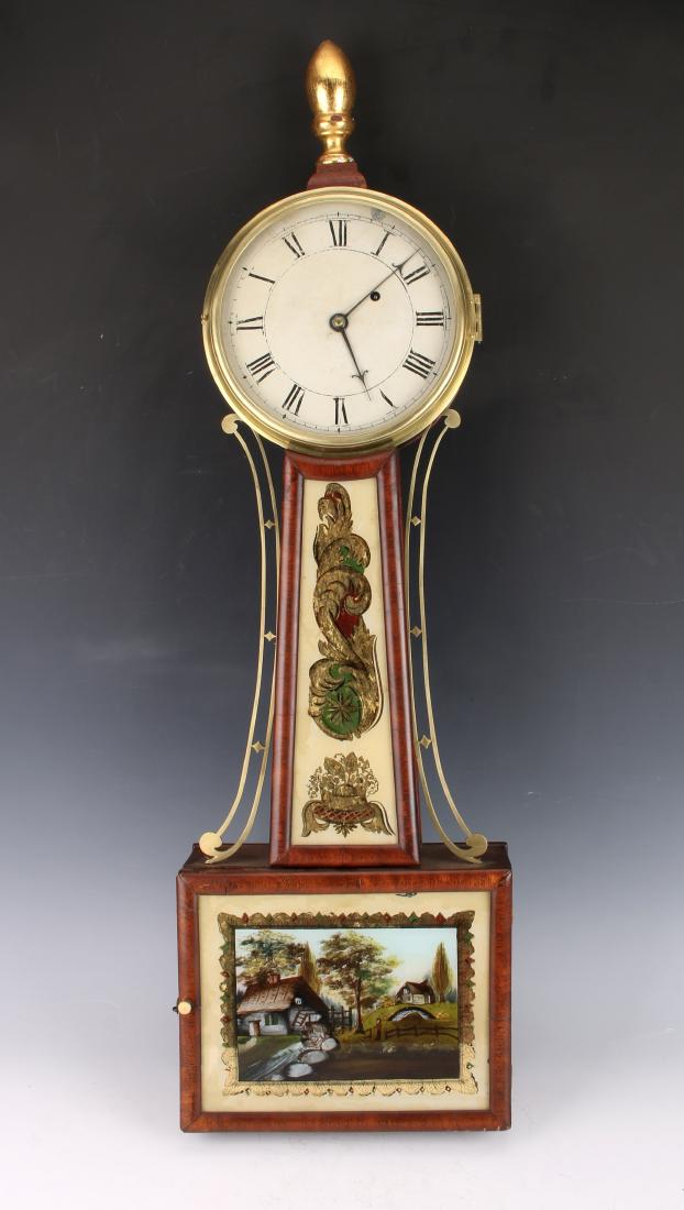 19TH CENTURY NEW ENGLAND BANJO CLOCK: 19TH CENTURY NEW ENGLAND BANJO CLOCK: Reverse painting on the box featuring a cabin with a water wheel and a farmer standing nearby. Gold leafed wooden finial. 32" with