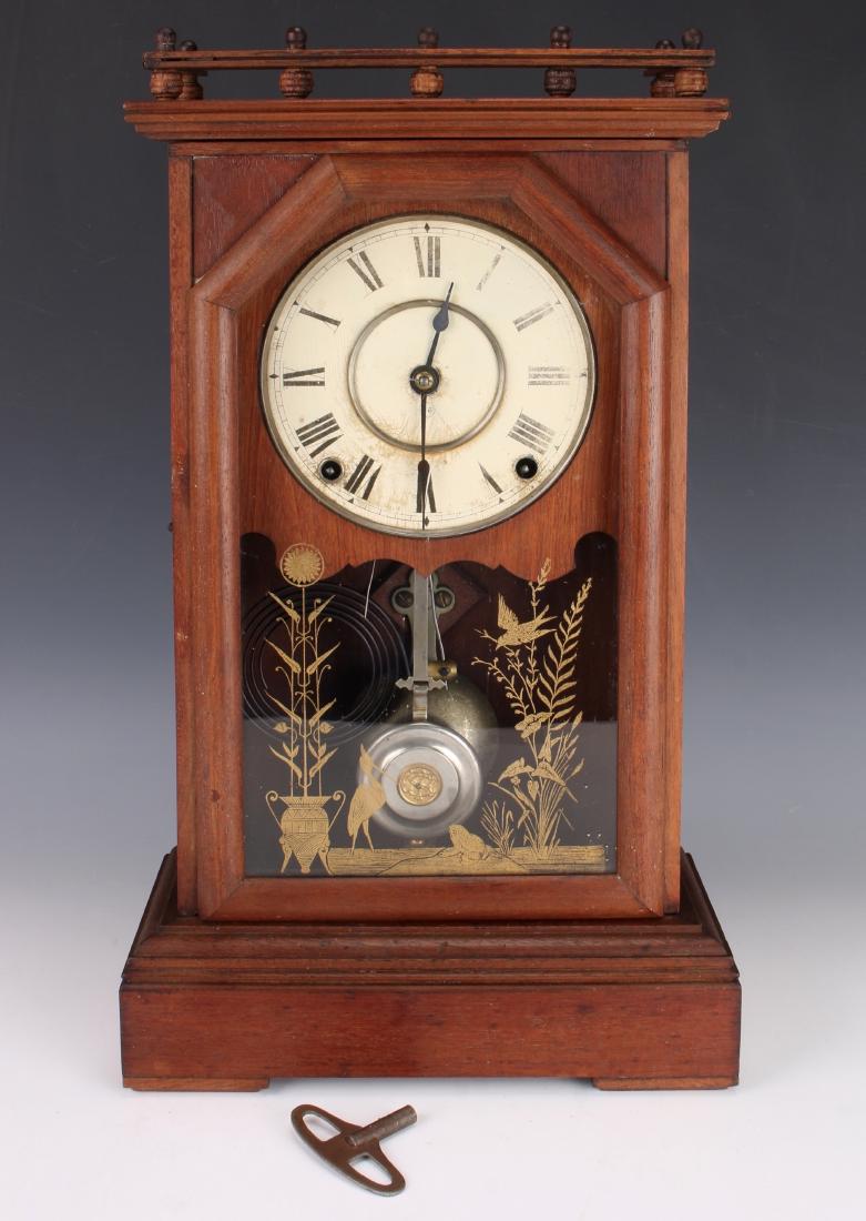 SETH THOMAS MANTEL CLOCK: SETH THOMAS MANTEL CLOCK: Reverse painted with gold stencil in an Art Nouveau style scene with stylized plants, birds, and frogs. The case has an upper gallery. Bracket is marked Patented May 9 1882.
