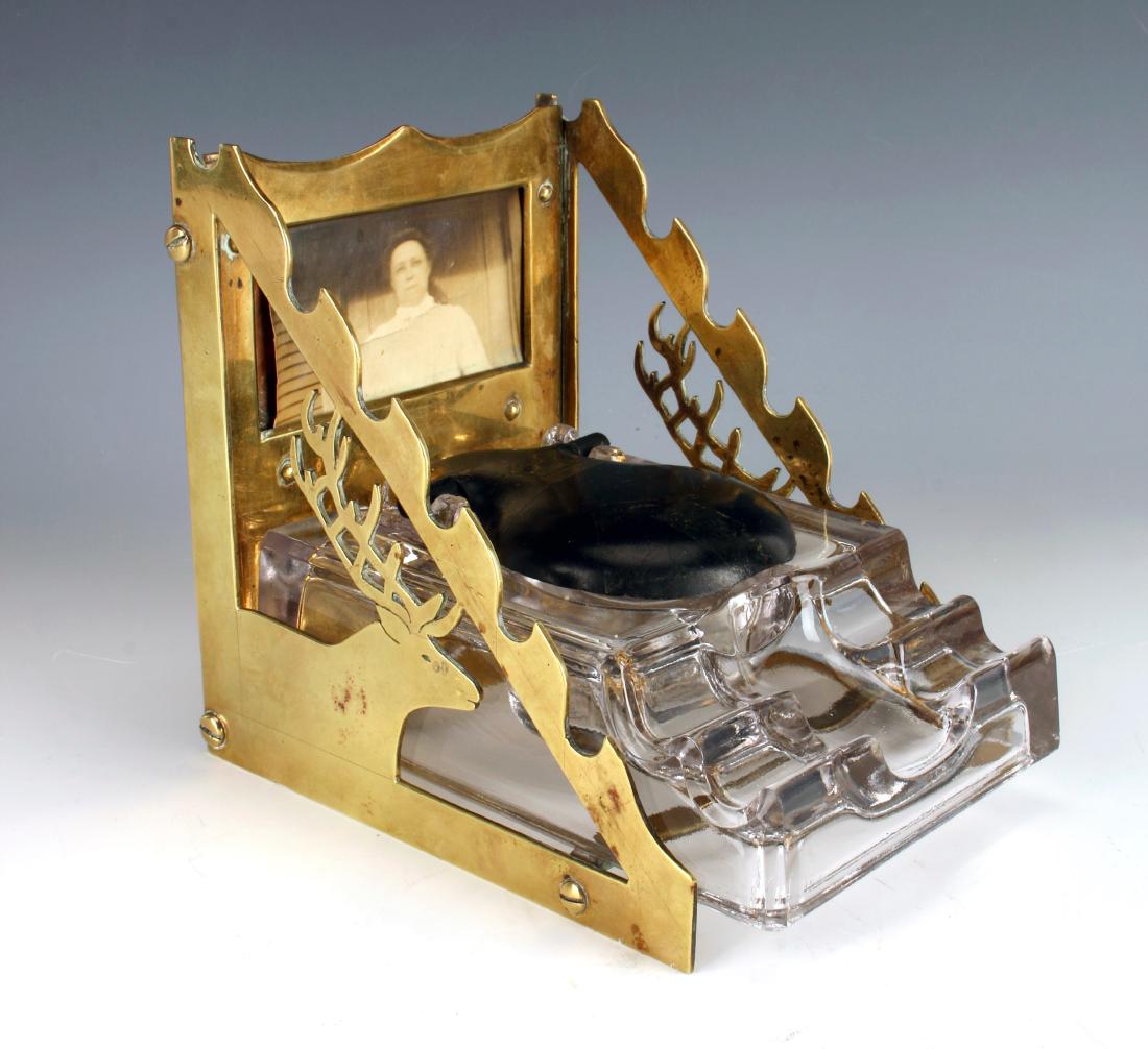 ANTIQUE F. WEEKS INKWELL IN BRASS STAG HOLDER: ANTIQUE F. WEEKS INKWELL IN BRASS STAG HOLDER: Complete and original Arts & Crafts brass stag sided desk caddy complete with Frank A Weeks 490 Paragon Glass Inkwell P