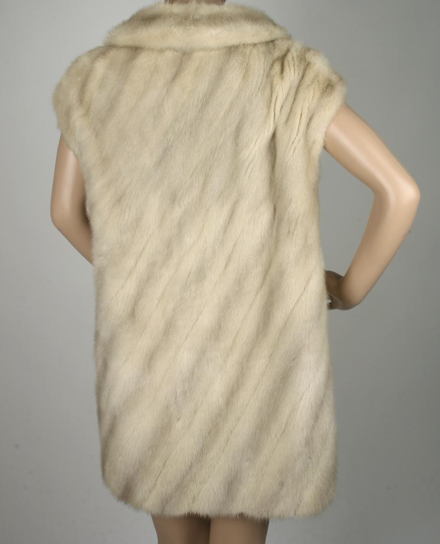 VINTAGE PALOMINO MINK TUNIC VEST: VINTAGE PALOMINO MINK TUNIC VEST: With deep V neck, notched collar, side slits and side hook closure, and front snap. Approx size 12. 32 1/2&quo
