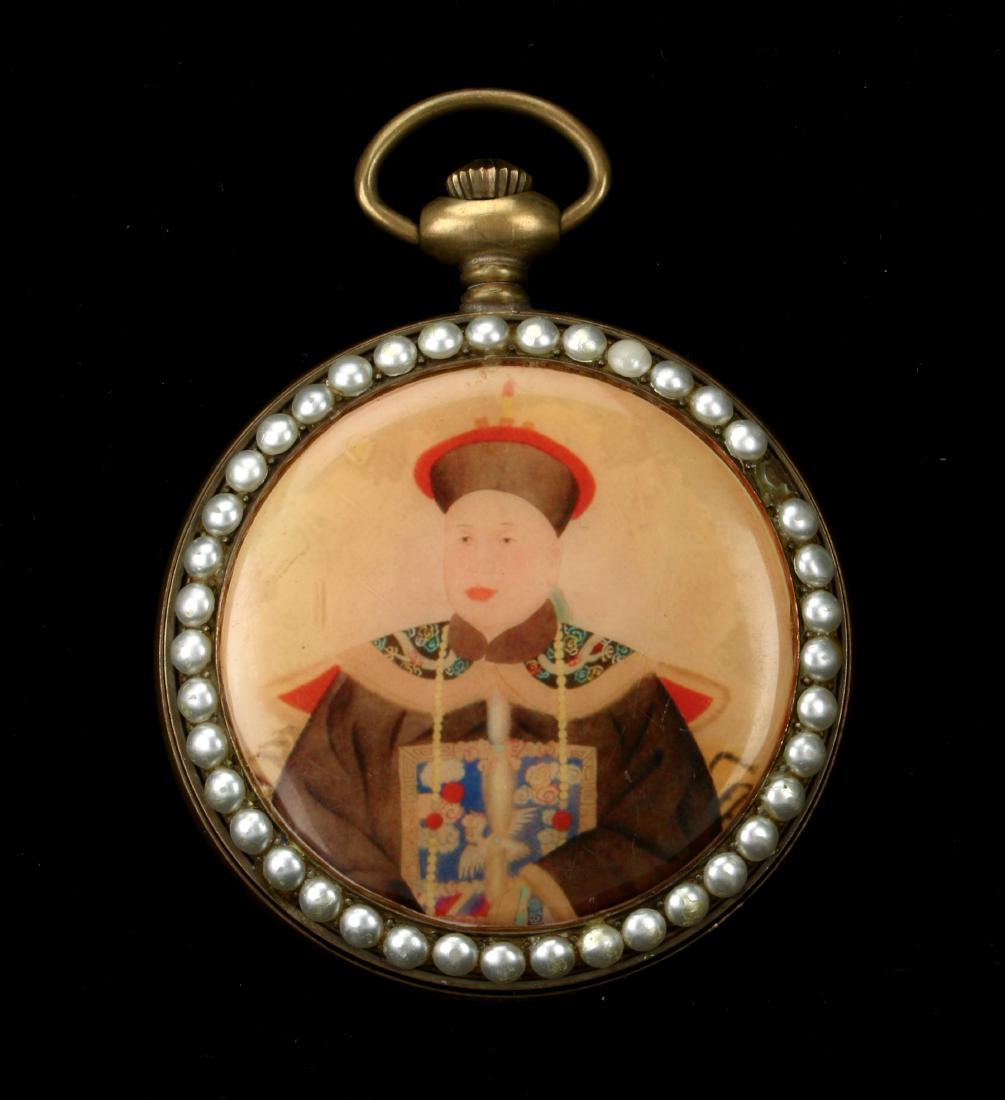 CHINESE ZODIAC POCKET WATCH: CHINESE ZODIAC POCKET WATCH: Ancestor portrait on the back. The face has a yin yang symbol in the middle surrounded by twelve characters with an outer border of zodiac animals. Front and back have fau