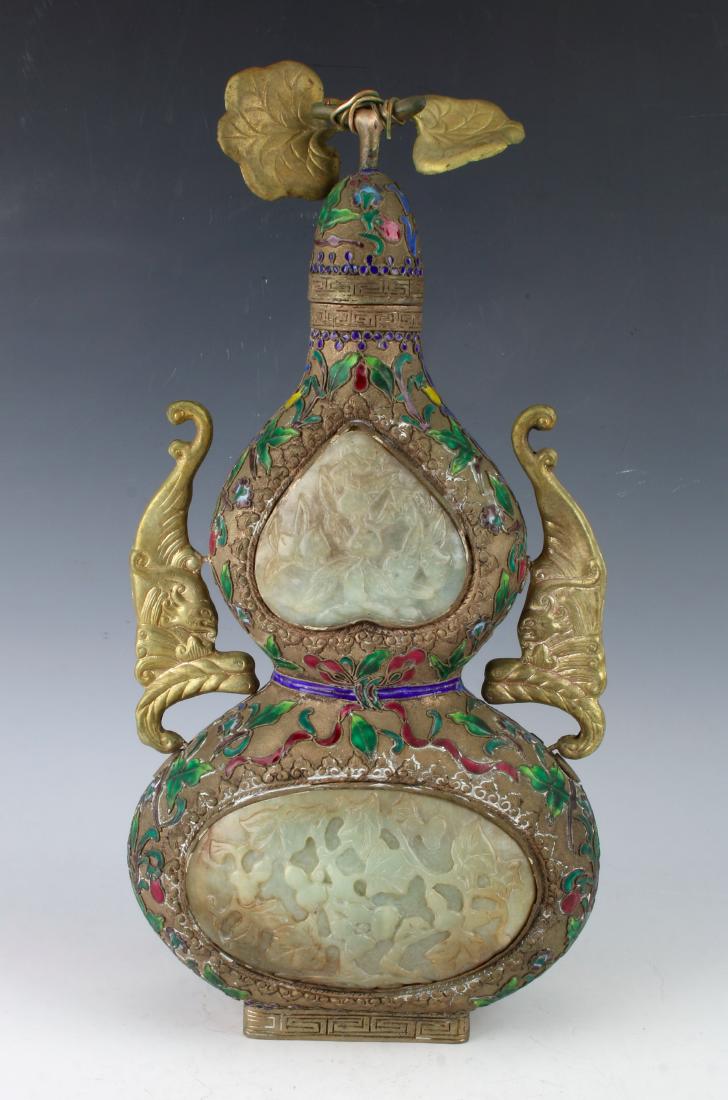 DOUBLE GOURD JADE & CHAMPLEVE VESSEL: DOUBLE GOURD JADE & CHAMPLEVE VESSEL : Gilt bronze dragon handles. The top part of the double gourd has a convex piece of jade in a peach shape carved in peaches on the front and back. A bat is on