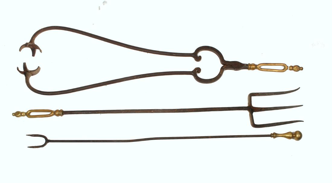 THREE HAND FORGED FIREPLACE UTENSILS: THREE HAND FORGED FIREPLACE UTENSILS: Hand forged fireplace tools. Included is a large pair of tongs, a two tong poker, and three prong poker. The poker with two prongs has a ball handle, the other tw
