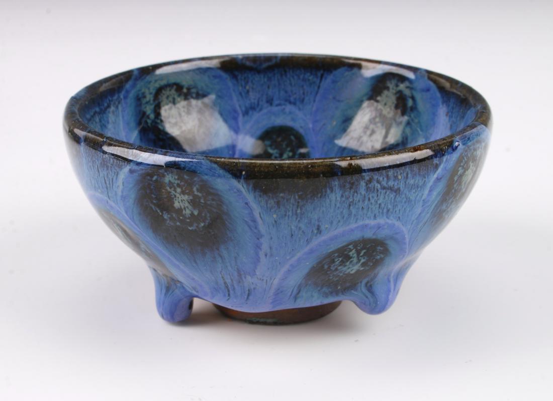 SMALL ANTIQUE CHINESE PEACOCK GLAZE BOWL: SMALL ANTIQUE CHINESE PEACOCK GLAZE BOWL: Small peacock bowl with a thick drip glaze that stops at the unglazed bottom and foot. 3 1/2" X 1 3/4" $400 - $6