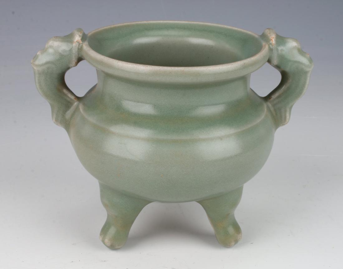 SMALL ANTIQUE TRIPOD CELADON CENSER: SMALL ANTIQUE TRIPOD CELADON CENSER: With pierced handles and stands on tripod feet. 4 1/2" X 3" $500 - $800 Shipping: We