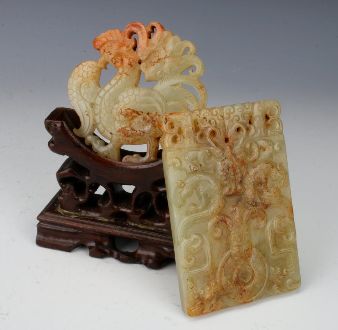 TWO PIERCED JADE MEDALLIONS IN PRESENTATION BOX: TWO PIERCED JADE MEDALLIONS IN PRESENTATION BOX: A pierced circular medallion of a rooster on both sides, and a rectangular medallion of back-to-back cats that is pierced at the top with dragon forms.