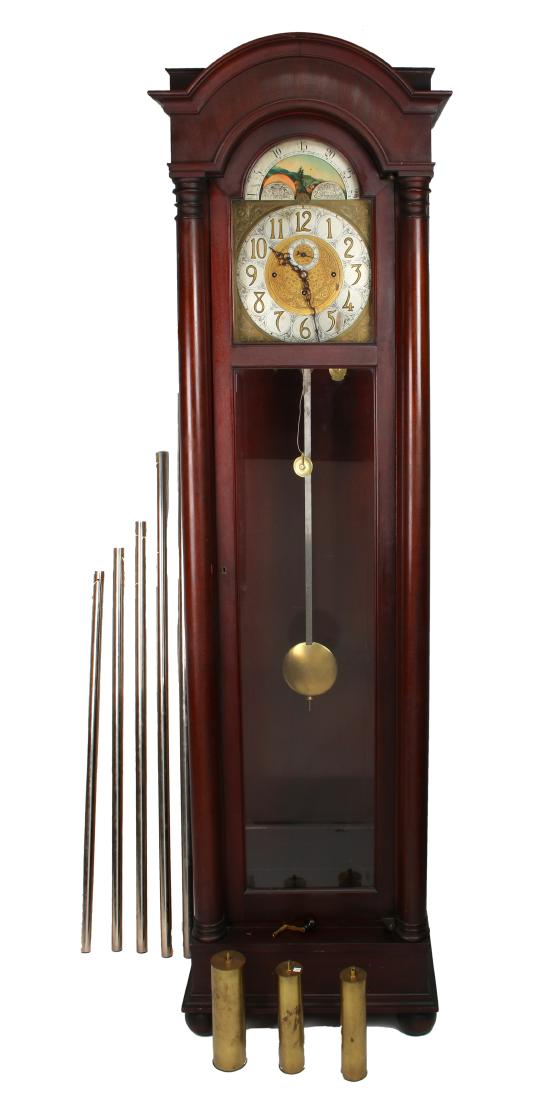 MAHOGANY COLONIAL FIVE TUBE HALL CLOCK: MAHOGANY COLONIAL FIVE TUBE HALL CLOCK: Five tube quarter chime hour, strike hall clock. Colonial Mfg Co Zealand, Mi. Flanked by two columns with an arched top and bun feet. Front and side lights are 