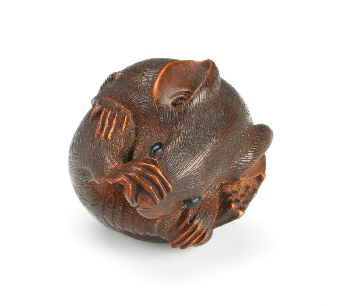 SMALL BOXWOOD CARVING OF RAT: SMALL BOXWOOD CARVING OF RAT: The rat is rolled in to a ball shape with one paw holding his tail and the other holding his face. Has detailed fur, ears, and tail. Signed on the bottom.