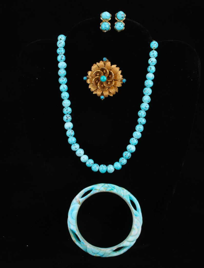 ASSEMBLED LOT OF TURQUOISE COSTUME JEWELRY: ASSEMBLED LOT OF TURQUOISE COSTUME JEWELRY: Matching glass faux turquoise necklace and earrings, plastic turquoise bangle, and a 1950s pin pendant marked Original by Robert.