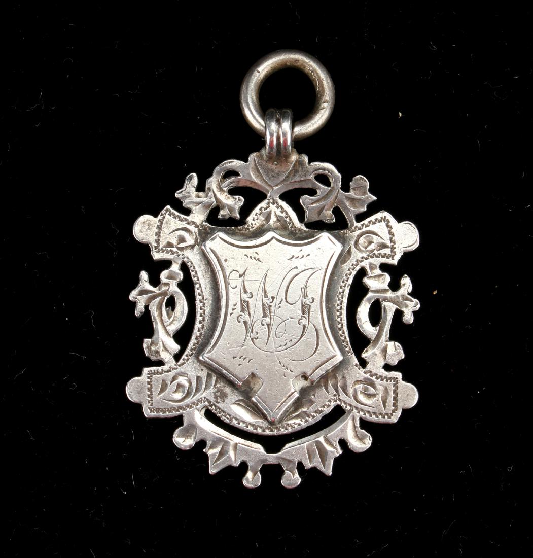 ANTIQUE HALLMARKED SILVER ENGLISH WATCH FOB 1901: ANTIQUE HALLMARKED SILVER ENGLISH WATCH FOB 1901: Marked with an anchor, a Lion Passant facing left, and a small “b” denoting Birmingham 1901 and the maker ini
