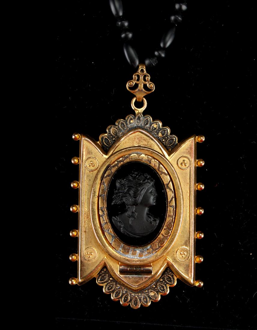 LARGE VICTORIAN MOURNING LOCKET CAMEO NECKLACE: LARGE VICTORIAN MOURNING LOCKET CAMEO NECKLACE: Large size mourning locket necklace. Beautiful wire work on a Victorian Locket and bale. A cameo is mounted on an onyx oval