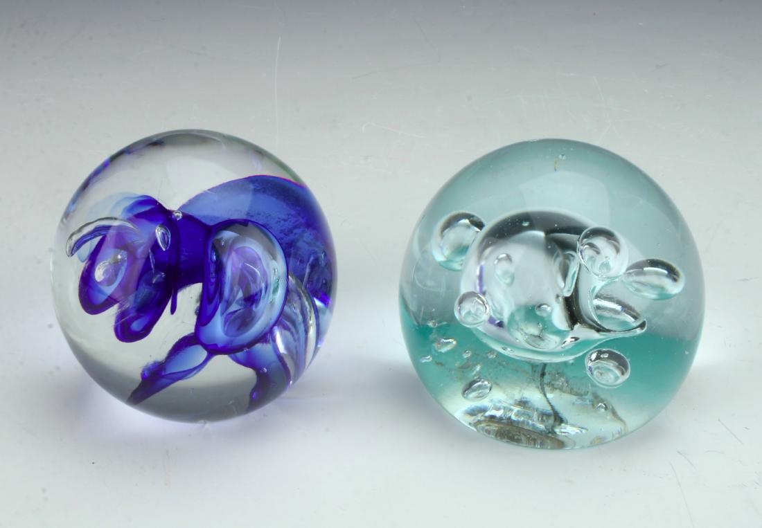 KARG BLUE SWIRL & CONTROLLED BUBBLE PAPERWEIGHTS: KARG BLUE SWIRL & CONTROLLED BUBBLE PAPERWEIGHTS: Vintage Jim Karg Blue Swirl & Controlled Bubble Paperweights. Blue swirl signed "Jim Karg" and clear bubble signed "Karg".
