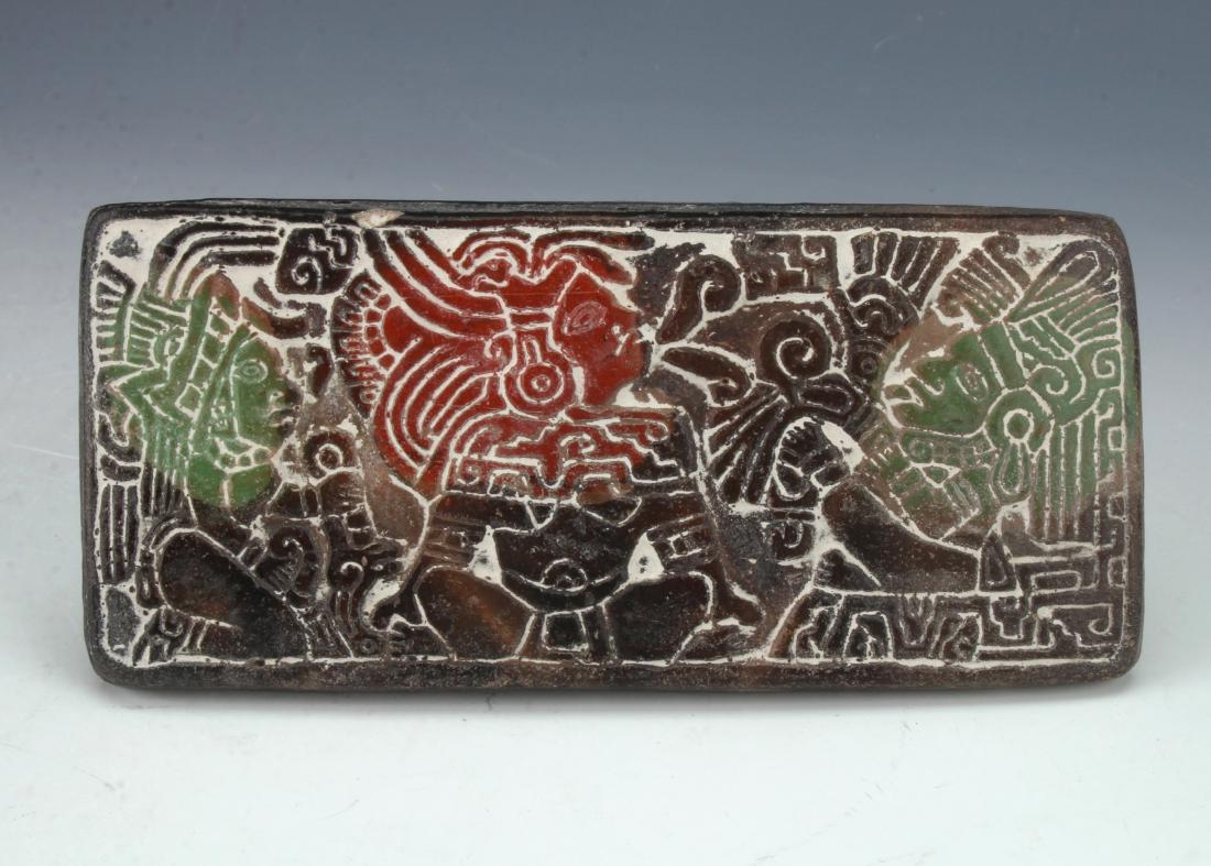 TERRA COTTA RITUAL CLAY STAMP: TERRA COTTA RITUAL CLAY STAMP: The handle is an animal head with teeth bared. Three Mayan Gods incised so when pressed into wet clay they would be seen in reverse. In brown, green, and terra cotta col