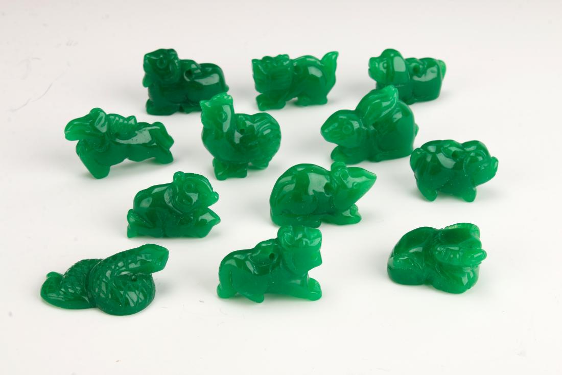 TWELVE PIECES CHINESE JADE ZODIAC ANIMALS: TWELVE PIECES CHINESE JADE ZODIAC ANIMALS: Twelve small green jade zodiac animals. Including rooster, dog, dragon, tiger, monkey, sheep, ox, rat, rabbit, snake, horse, and pig. Look carefully at the c